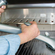 Grill Daddy has a water squirting mechanism to generate steam on a hot grill, which helps clean stuck-on gunk.